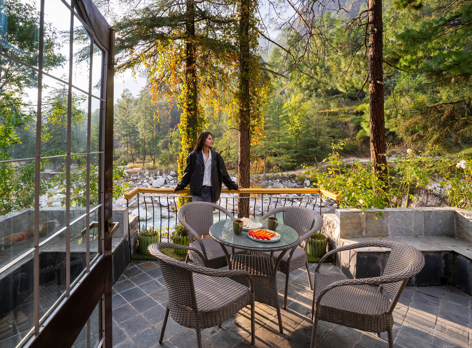 Balcony seating of the Hall Balcony Suite overlooking the pine forest